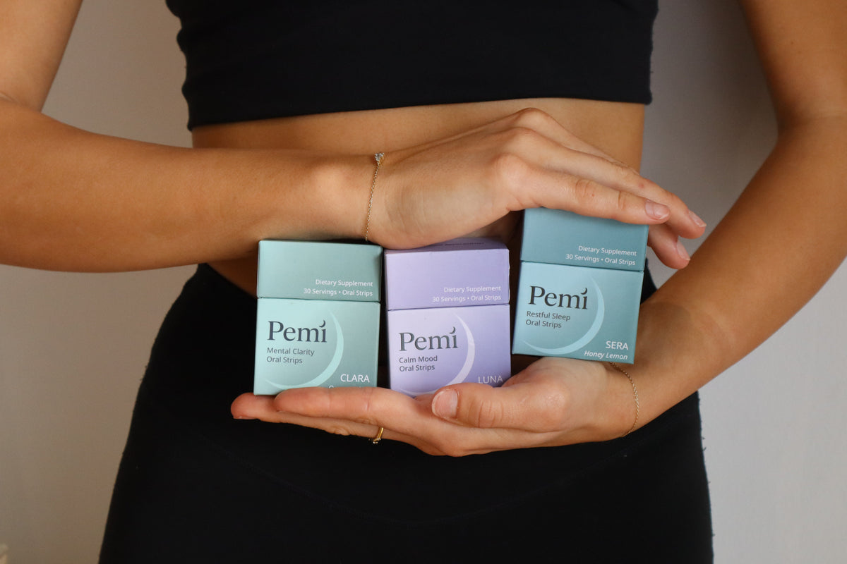 Hands holding the three Pemi cartons: Luna, Clara and Sera